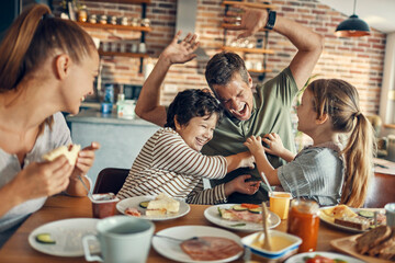 Family enjoying breakfast together