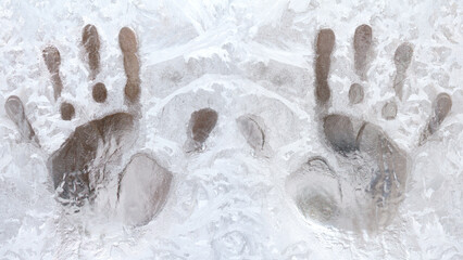 fingerprints on a frozen window