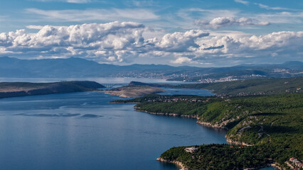 Fototapeta premium Aerial drone view of Crikvenica and Dramalj with turquoise Adriatic Sea, green-blue waters, beaches, and the island of Krk in the distance. Taken on 27.09.2025 in Dramalj, Croatia.