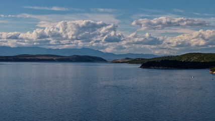 Aerial drone view of Crikvenica and Dramalj with turquoise Adriatic Sea, green-blue waters, beaches, and the island of Krk in the distance. Taken on 27.09.2025 in Dramalj, Croatia.