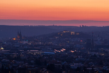 Brno, Czech Republic - March 29, 2025: View of the city from above at night. Evening city panorama. Špilberk Castle