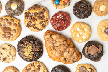 Assortment of gourmet cookies on white background