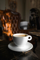 A cup of black coffee in a cafe with copy space