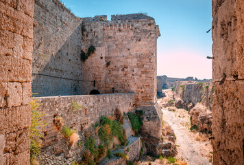The medieval city walls, part of the fortification of the old town of Rhodos and the medieval moat. In Rhodos Island, Dodecanese, Greece.