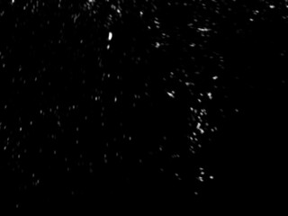 Light snowfall snow against black background. Works well as an overlay. Fine small snows. White snowflakes on black background, Blurred abstract defocused effect. Use with screen blending layer mode