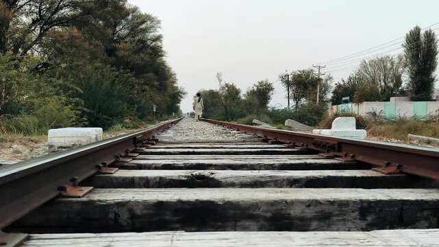 Railroad tracks stretching into the distance perspective view of railway lines transportation infrastructure