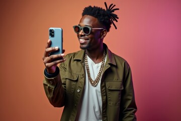 Confident and charismatic rapper flaunting trendy style and smartphone savvy.