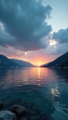 Cloudy dusk descends on Makarska Riviera's bay, calm sea reflecting grey sky , evening, grey, gradation
