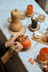 Fototapeta premium Preparing to paint a pumpkin for Halloween at home