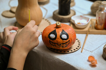 
Preparing to paint a pumpkin for Halloween at home