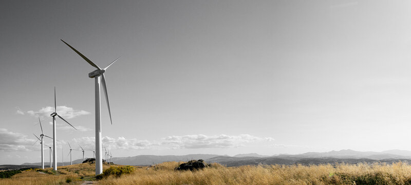 Image for Copy Space with windmills and a sky with white clouds and gray color in a Castilian countryside in Spain.