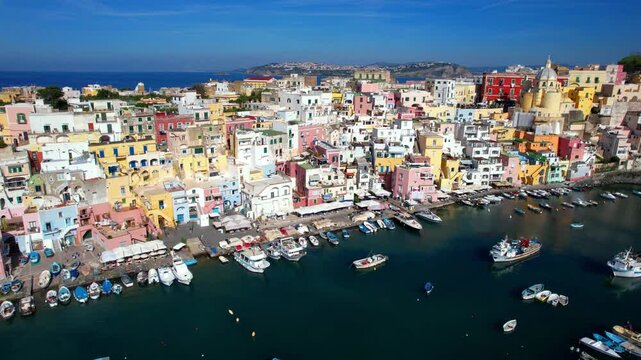 Italy tourism,  Most scenic and colorful island - beautiful Procida in gulf of Naples. Campania region. Port of Corricella village . aerial 4k hd drone video
