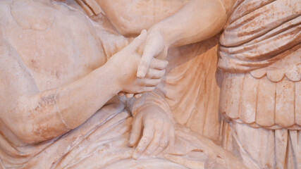 Detail of the handshake between two Greek statues at the National Museum of Greece