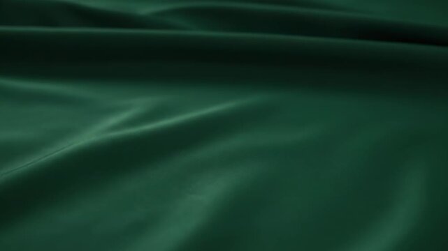 Elegant Dark Green Fabric Drape - Close-up view of smooth, lustrous dark green fabric arranged in elegant, flowing folds. The texture and subtle sheen of the material are highlighted.