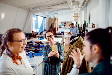 Women in fashion store taking photos