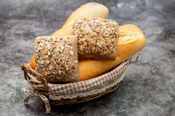 Different freshly baked bread loafs in basket