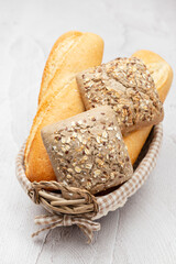 Different freshly baked bread loafs in basket
