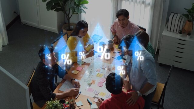 A diverse team collaborates in a modern office environment, engaged in brainstorming sessions while digital graphics illustrate data and percentage metrics for analysis. Raster - Powered by Adobe