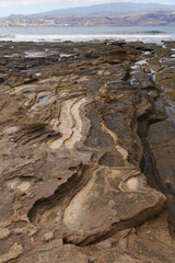 Gran Canaria, textures of the rocks of El Confital beach on the edge of Las Palmas de Gran Canaria, low tide