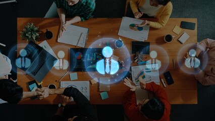 A diverse group of professionals collaborates at a conference table, engaged in business strategy discussions and data analysis with modern technology and innovative ideas. Raster