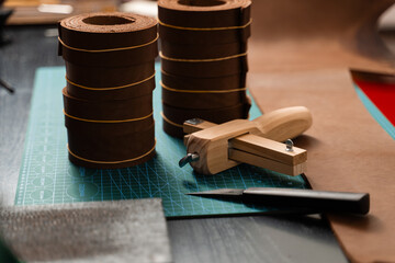 Sharp strap cutter and leather rolls, essential for crafting accurate belt straps. Leather rolls...