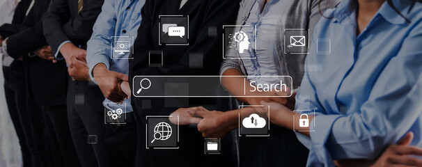 A diverse group of professionals stands together, showcasing a mix of technology and communication symbols, highlighting modern workplace collaboration and engagement. Trope