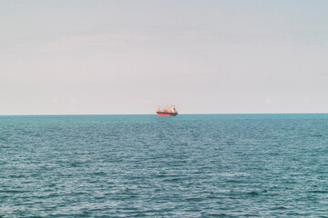 Large cargo ship, container carrier in the open sea. Industrial