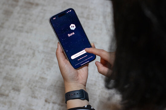 Portland, OR, USA - Oct 1, 2025: An iPhone user opens the new Sora app launched by OpenAI based on its latest video generation model, Sora 2. Sora is a text-to-video model generating short video clips