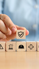 Hand of a business person holding a red button with the word YES as a concept of success or support for service