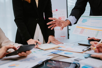 Business team analyzing income charts and graphs with modern laptop computer and digital tablet. Close up. Business analysis and strategy concept