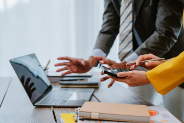 Hands, paperwork and business people in office with statistics, data or graphs for finance. Team,...