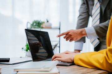 Business team analyzing income charts and graphs with modern laptop computer and digital tablet. Close up. Business analysis and strategy concept