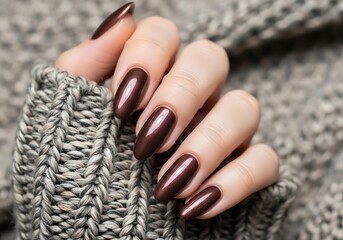 Elegant almond shaped nails with rich chocolate brown metallic polish