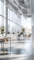 A blurred modern office interior with a long hallway, panoramic windows, and reflective floors