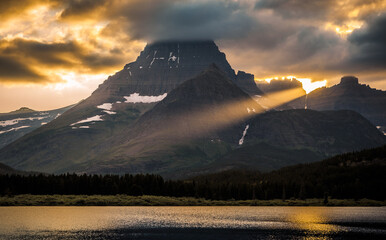 Sunset Light Through the Mountains of Glacier above Swiftcurrent Lake, Many Glacier, Glacier National Park, Montana