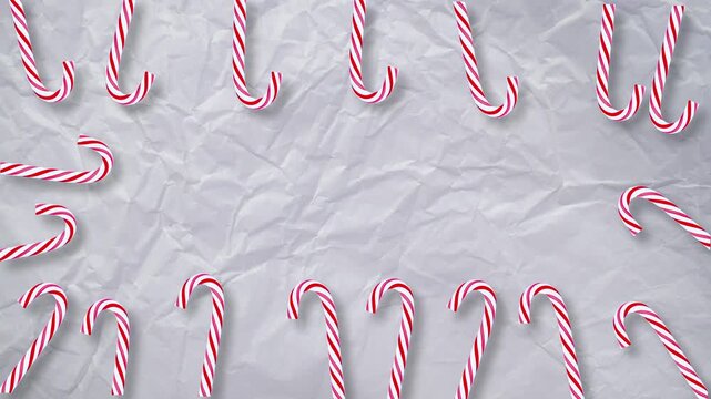 Animated Christmas video with candy canes forming festive frame on crumpled paper background, center space for custom text, winter holiday motion graphic template, greeting card design.