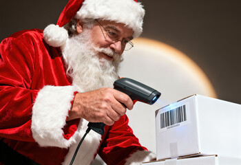 Santa Claus scanning barcode on shipping box