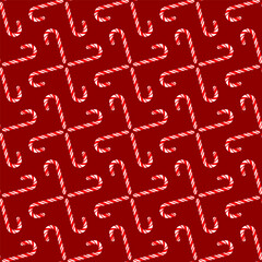 Christmas seamless pattern of folded sugar canes on a red background