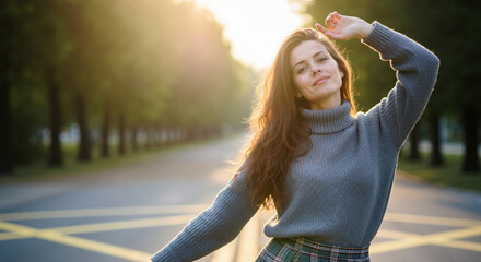 Woman in grey turtleneck sweater and plaid skirt with hand shading eyes in golden sunset light. Academic autumn style for student fashion brands, preppy wear campaigns and school clothing