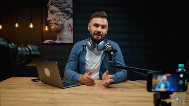 Charismatic male vlogger recording video for social media