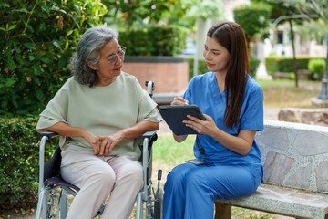 Caregiver provides assistance and support to senior in serene outdoor setting, ensuring quality care and companionship during their time together
