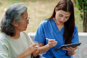 Caregiver provides assistance and support to senior, ensuring they receive necessary care while using tablet for communication or information