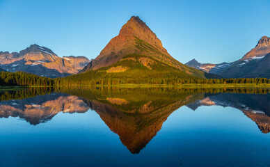 Crystal Clear Reflections of the Mountains on Swiftcurrent Lake, Many Glacier, Glacier National Park, Montana
