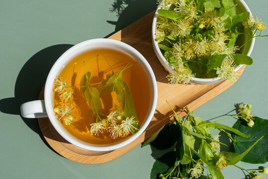 Top view of herbal linden tea with fresh flowers