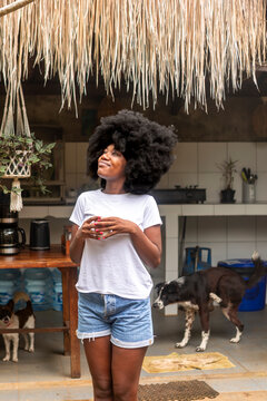 Afro woman relaxing in a tropical Balinese setting