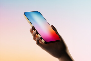 Hand holding a mobile phone displaying a colorful screen