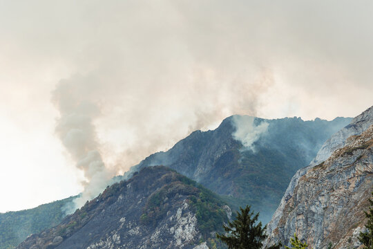 Smoke rising from forest fires in Somiedo Valley, Asturias