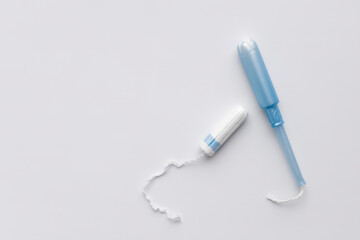 Tampon and applicator on a white background