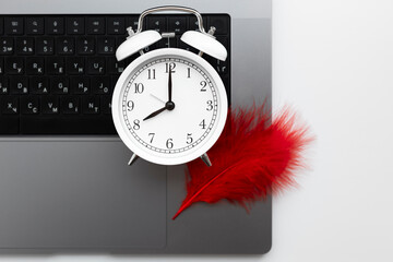 Clock and red feather symbolizing menstrual cycle timing