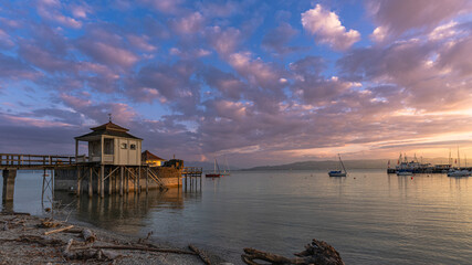 Historic pier house on Lake Constance at sunrise
